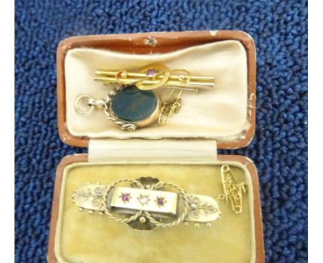 A cased Victorian diamond and ruby brooch; together with a 9ct fob and a 9ct bar brooch