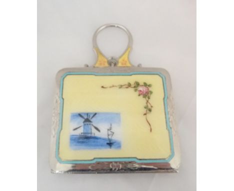 A silver and enamel gilt compact
