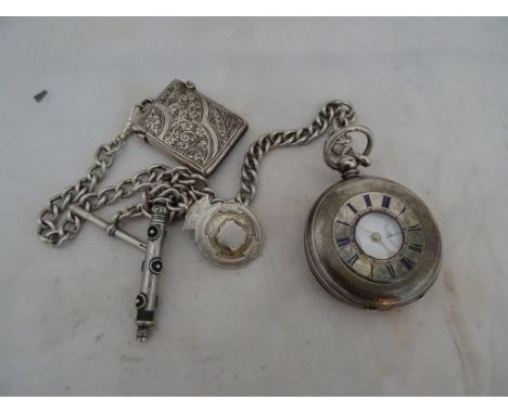 An Edwardian silver pocket watch with enamel Roman numerals to front: import marks London 1909: and sponsor's marks for H.Sam