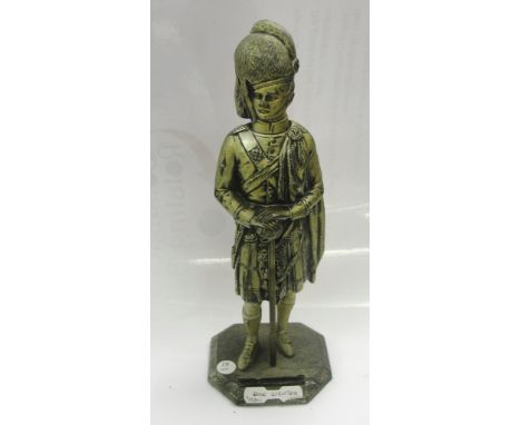 A bar lighter in the form of a Scottish Officer, with flip top head revealing tip lighter