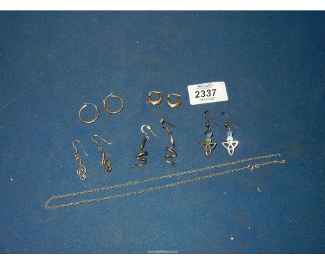 A small quantity of earrings, some silver and gold including a pair of 9ct gold Creole hoops, silver twist earring, pair of e