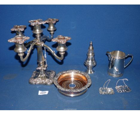A Sheffield plate on copper bottle coaster, Arthur Price jug with swag decoration, sugar castor, two decanter labels and a fi