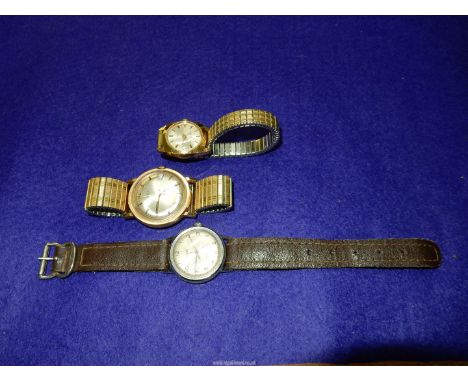 Three Timex crown wound Wristwatches including water resistant with beige face with Arabic numerals, hour markers and leather