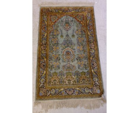 A Central Persian prayer rug with a mirab, flowerheads, birds and other ornament of a pale turquoise ground  60'' x 36''