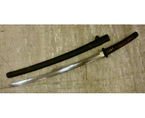 A World War II Japanese Katana, having a rope wrapped handle and a plain tsuba  the blade 24.5''L in a textured, painted hard