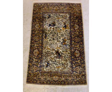 A Persian pictorial rug with hunters, horses and other animals on a cream coloured ground  58'' x 37'' 