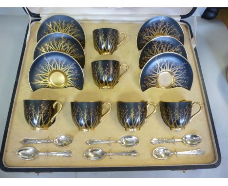 A set of six Royal Worcester bone china coffee cups and saucers, decorated in Art Deco taste with gilded, stylised gold and r