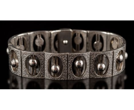 A 20th century silver bracelet each rectangular panel inset with a single bead, together with a matching sterling silver pend