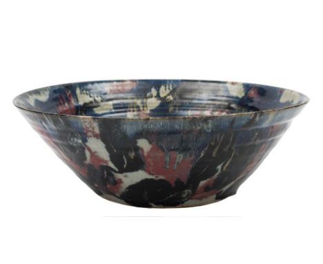 * Janice Tchalenko [1942-2018] a large stoneware bowl: of mildly ribbed and flaring form decorated with arbitrary black, crea