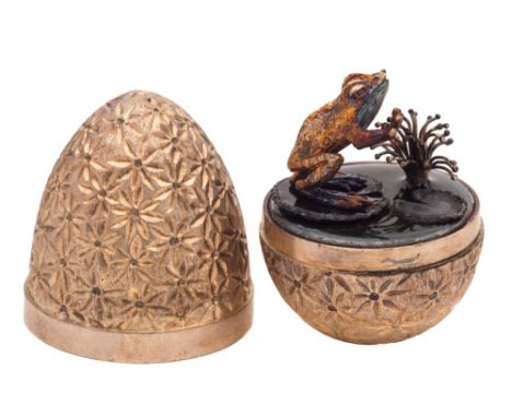 A Stuart Devlin silver gilt novelty egg, London, 1978: the lift-off cover enclosing a silver and enamel leaping toad, the ext