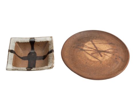 * Janet Leach [1918-1977] two stoneware dishes: one of circular form with deep foot the upper surface with matt brown wash an