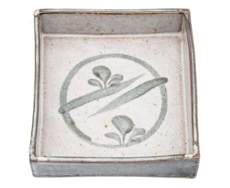 * John Maltby [b. 1936] a stoneware shallow dish: of shallow square profile the interior painted in grey with foliate motifs 