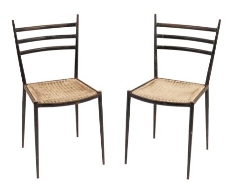 A pair of Lloyd Loom 'Lusty' blackened iron dining chairs:, with curved railed backs and bowed cane panel seats, on tapered l