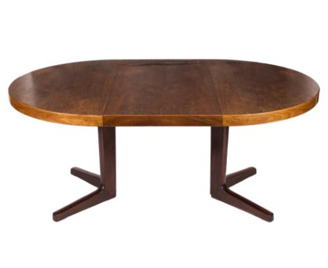 A 1960's teak and rosewood circular extending dining table:, on a central cruciform column and base, the top 115cm (3ft 9 1/4