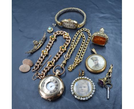 A leather bound trinket box containing a selection of rolled gold jewellery including small half hunter pocket watch, chains,