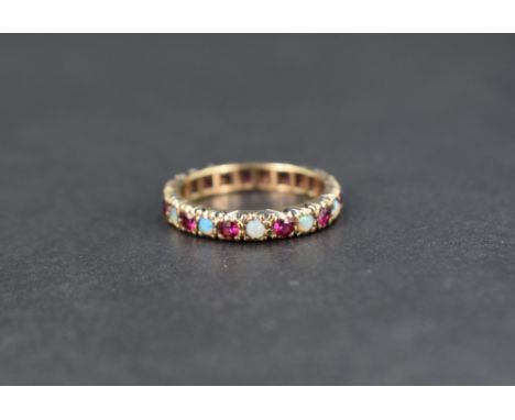 An opal and ruby set full eternity ring in 9ct gold, size L &amp; approx 2.5g