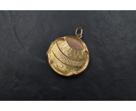 A yellow metal locket of circular form with engine turned decoration to top and reverse, marked '9ct back and front', 5.3g