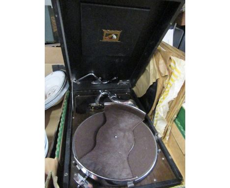 An HMV portable Record Player together with records