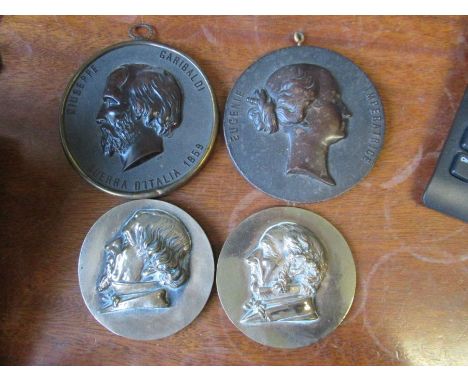 Two 19th century French Bois Durci portrait plaques, depicting Eugenie Imperatrice and Giuseppe Garibaldi, diameter 4.5ins, t