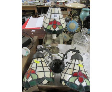 A Tiffany style table lamp, together with a similar wall light
