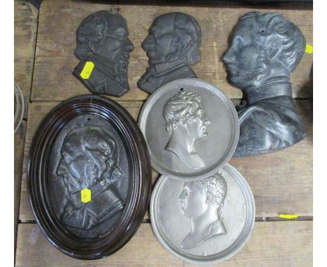 Six relief moulded circular metal portrait plaques, including Disraeli and Prince Albert
