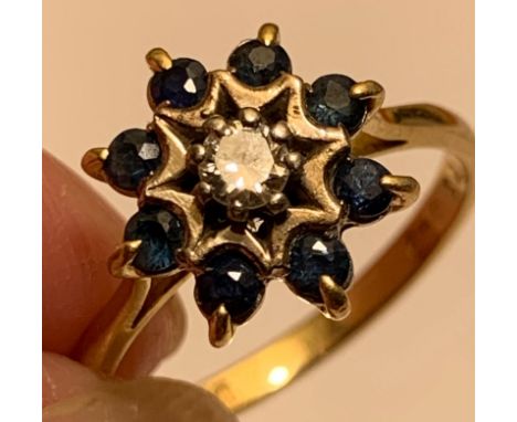 18ct GOLD RING SET WITH ONE APPROX 0.25ct DIAMOND AND EIGHT APPROX 0.7ct SAPPHIRES, TOTAL WEIGHT APPROX 4.15g

 