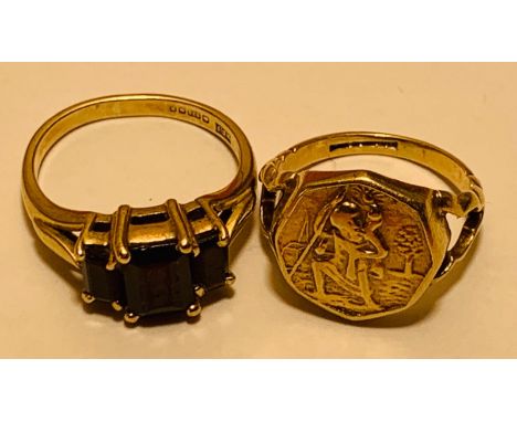 9ct GOLD RING DEPICTING A SAINT, SIZE F, TOTAL WEIGHT APPROX 2.8g, AND ALSO 9ct GOLD RING SET WITH THREE GARNETS, SIZE H+, TO