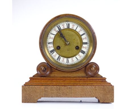 A Victorian light oak drum-cased mantel clock, on moulded base, enamel dial and 8-day movement striking on a gong, height 27c