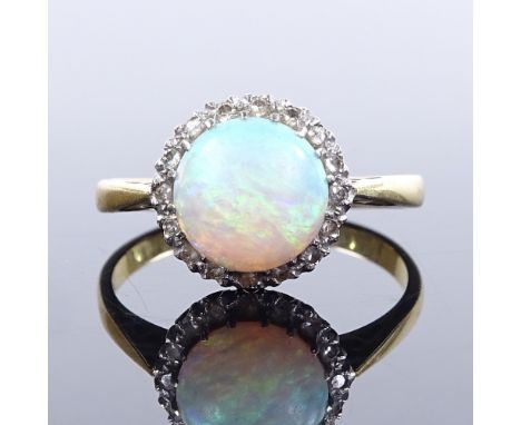 An 18ct gold cabochon opal and diamond cluster ring, setting height 10.2mm, size K, 2.5g 