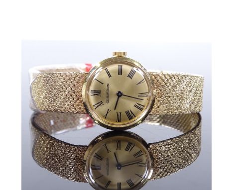 JAEGER LECOULTRE - a lady's 9ct gold mechanical wristwatch, champagne dial with Roman numeral hour markers and 9ct mesh strap