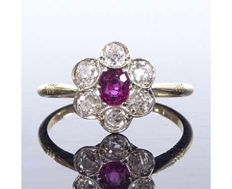 An 18ct gold ruby and diamond cluster flowerhead ring, setting height 11.2mm, size O, 2.5g 