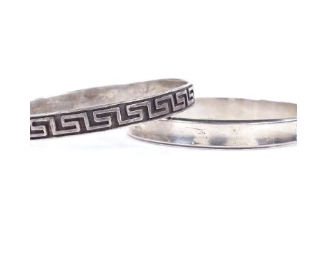 A Danish sterling silver bangle of plain form, maker's marks RS, band width 9.1mm, internal diameter 63mm, together with anot