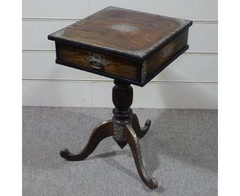 An Indian hardwood side table with brass mounts, drawer and tripod base 