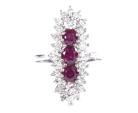 An 18ct white gold ruby and diamond cluster cocktail ring, total diamond content approx 1ct, setting height 23.9mm, size M, 5