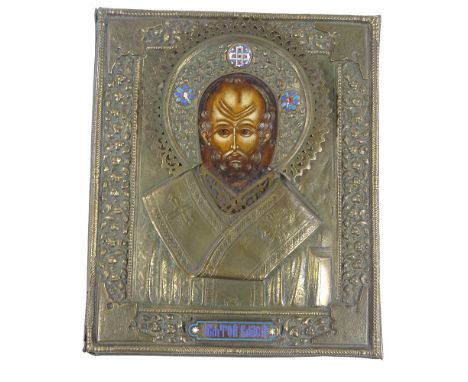 A Russian relief moulded brass-framed icon, with inset painted panel and small enamel mounts, 29cm x 24cm 