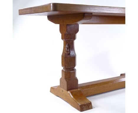 Robert Thompson (Mouseman), a golden oak stretcher table with carved end column supports and square stretcher, 92cm x 37cm, h