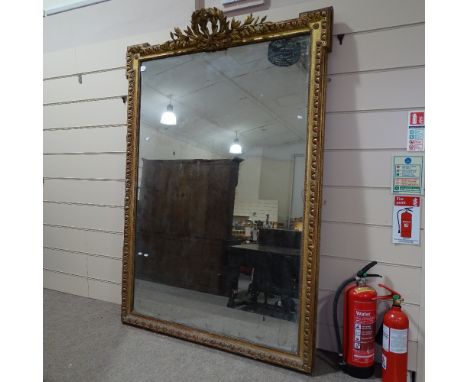 A large 19th century carved giltwood and gesso-framed pier glass mirror, with laurel pediment, height including pediment 6'6"