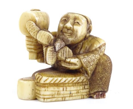 A Japanese Meiji Period ivory netsuke depicting the God of Wealth, signed under base, height 4cm 