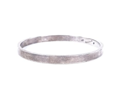 A Danish sterling silver bangle, of plain form, maker's marks FK, band width 6mm, internal diameter 63mm, 35.9g 