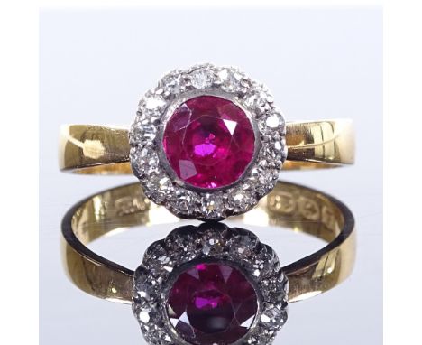 A 22ct gold ruby and diamond cluster flowerhead ring, ruby approx 1ct, setting height 10.7mm, size R, 3.8g 