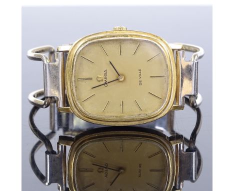 OMEGA - a lady's gold plated Deville mechanical bangle wristwatch, champagne dial with gilt baton hour markers, 17 jewel move