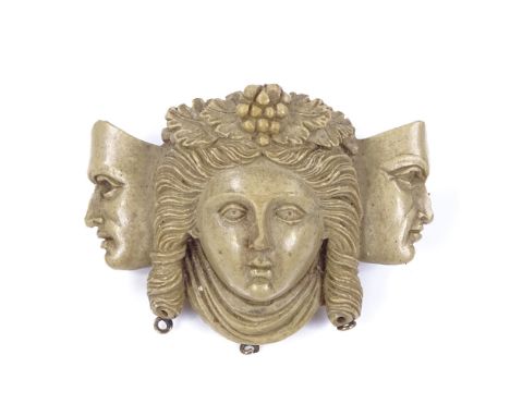A relief carved lava cameo brooch, depicting female portrait and flanking masks, brooch length 42.5mm, 17.1g 
