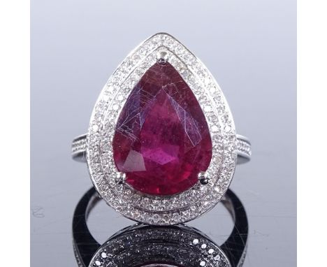 A 14ct white gold ruby and diamond cluster ring, pear-cut ruby approx 7.43ct, total diamond content approx 0.6ct, setting hei