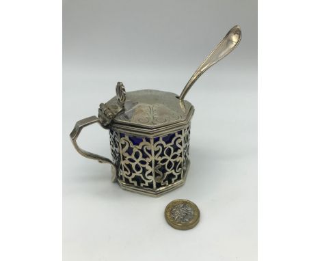 A Victorian London silver pierced condiment pot, fitted with original blue liner, Together with a Sterling silver shell desig