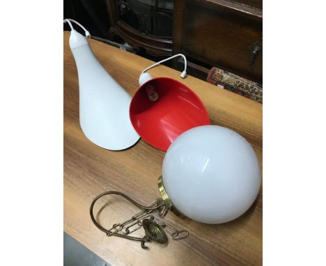 A pair of retro lamp shades and white globular ceiling light. 