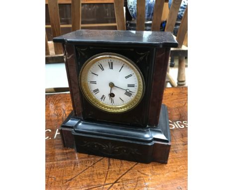 A Victorian slate and granite cased mantel clock, Gilt brass and enamel face, in a running condition. 
