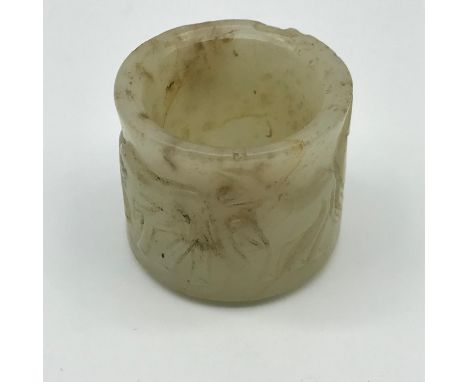 A 17th/ 18th century hand carved Chinese archers ring, carved with horse style figures.