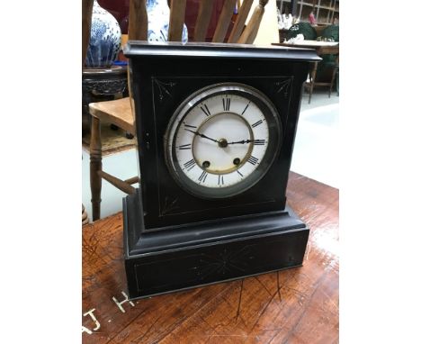 A Victorian slate cased mantle clock, White enamel face,  in a running condition. 
