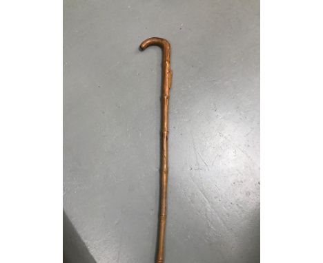 Antique oriental hand carved walking stick, Carved with a locus, leafs and the shaft styled like a bamboo branch. Measures 89