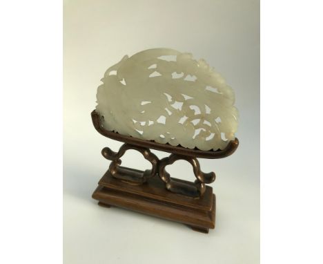 A 19th century Chinese white jade and hardwood table screen, Jade is ornately carved showing a phoenix design, Measures 11.5x